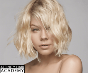 A blonde short angled bob with gentle waves.