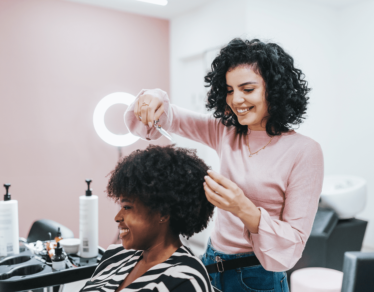 Woman enjoying haircut at salon