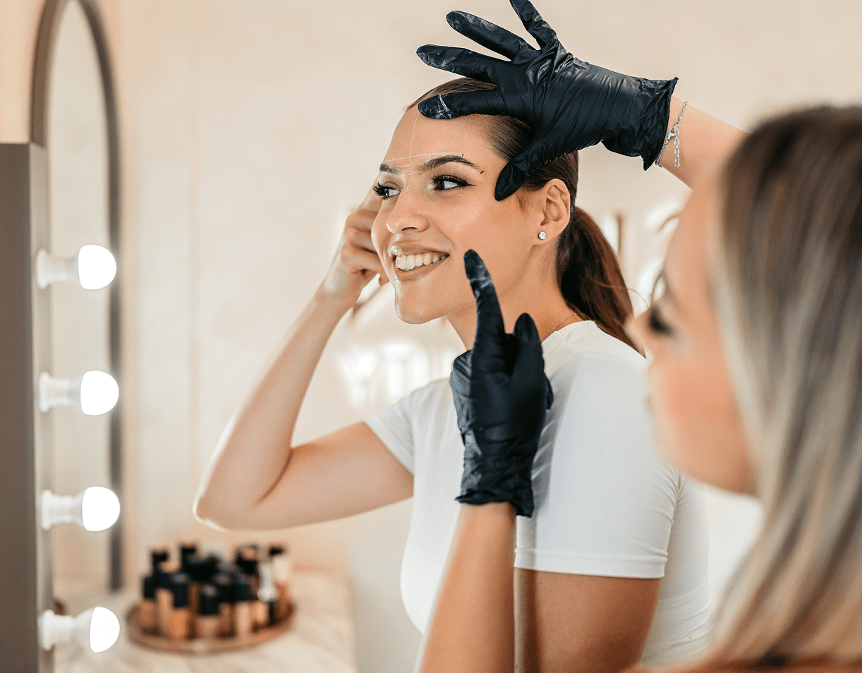 Smiling woman getting beauty treatment at salon