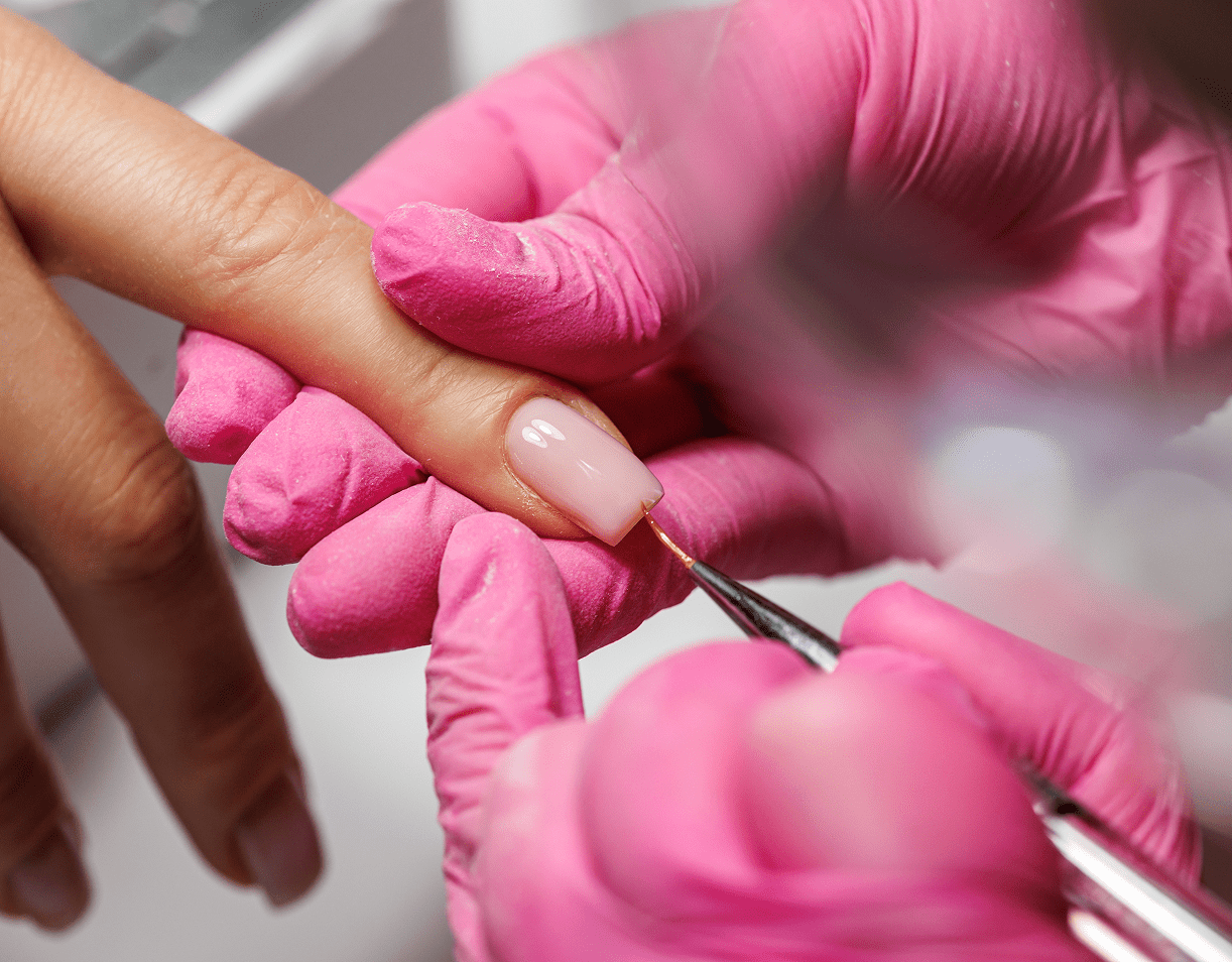 Manicure process with pink gloves